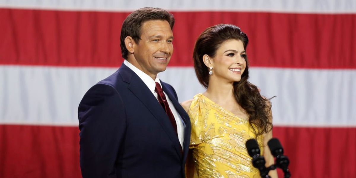 NextImg:Man claims Florida first lady Casey DeSantis made 'a racist fashion statement' by wearing Florida alligator 'WHERE WOKE GOES TO DIE' jacket