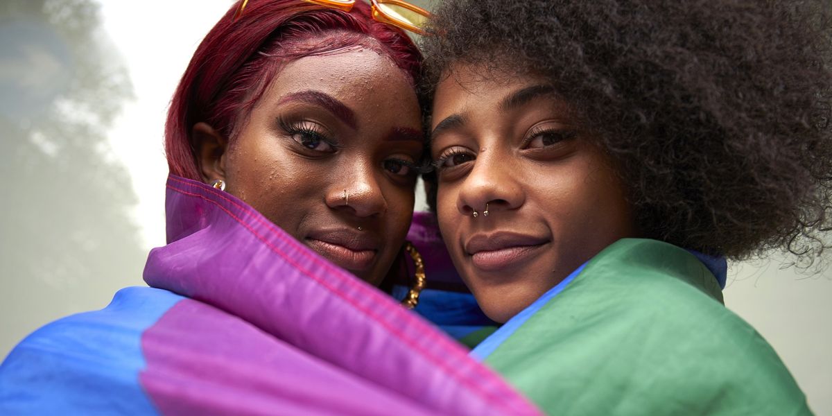 Two-women-wrapped-in-Pride-Flag