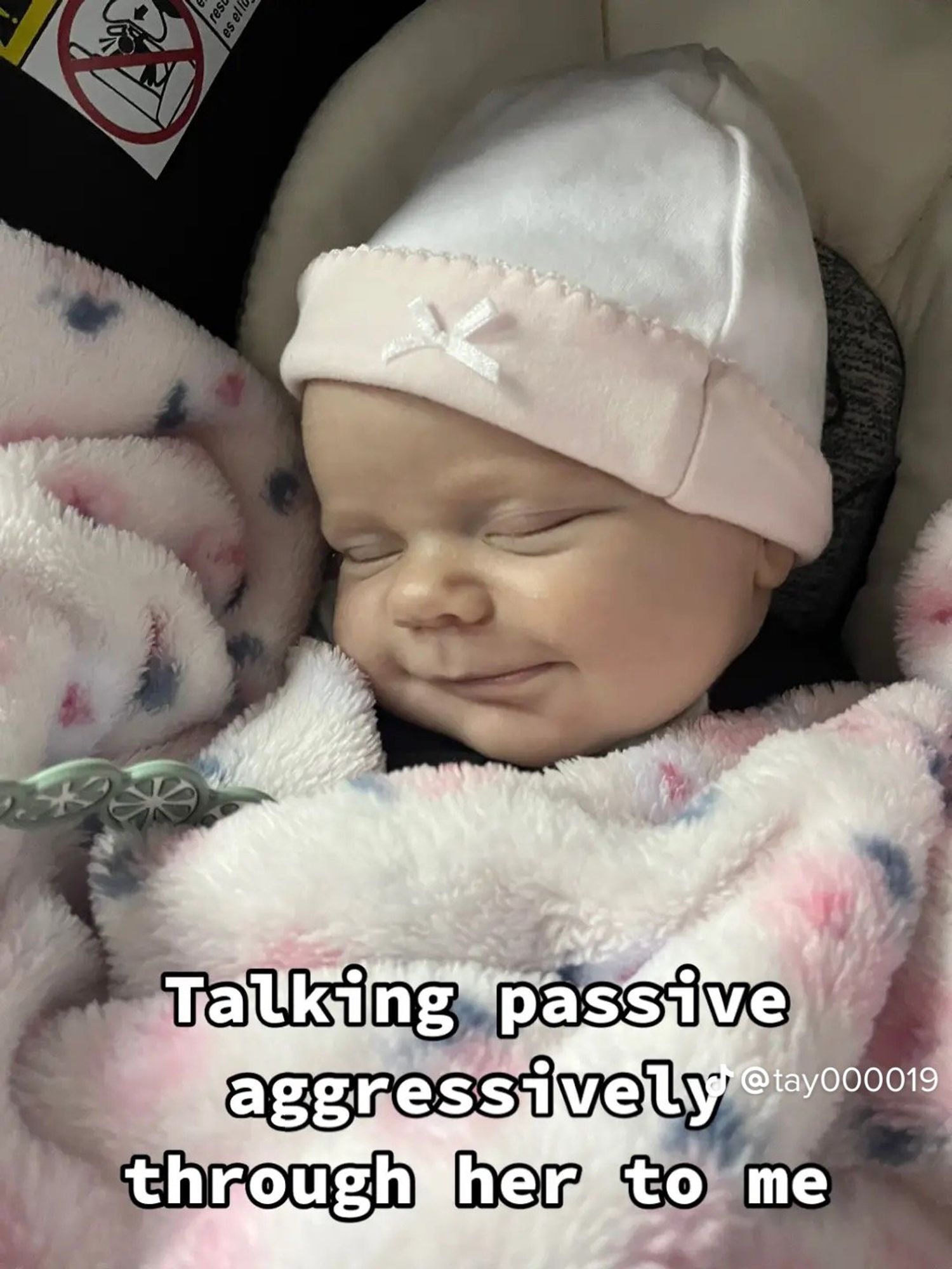 newborn smiling while sleeping with text overlay