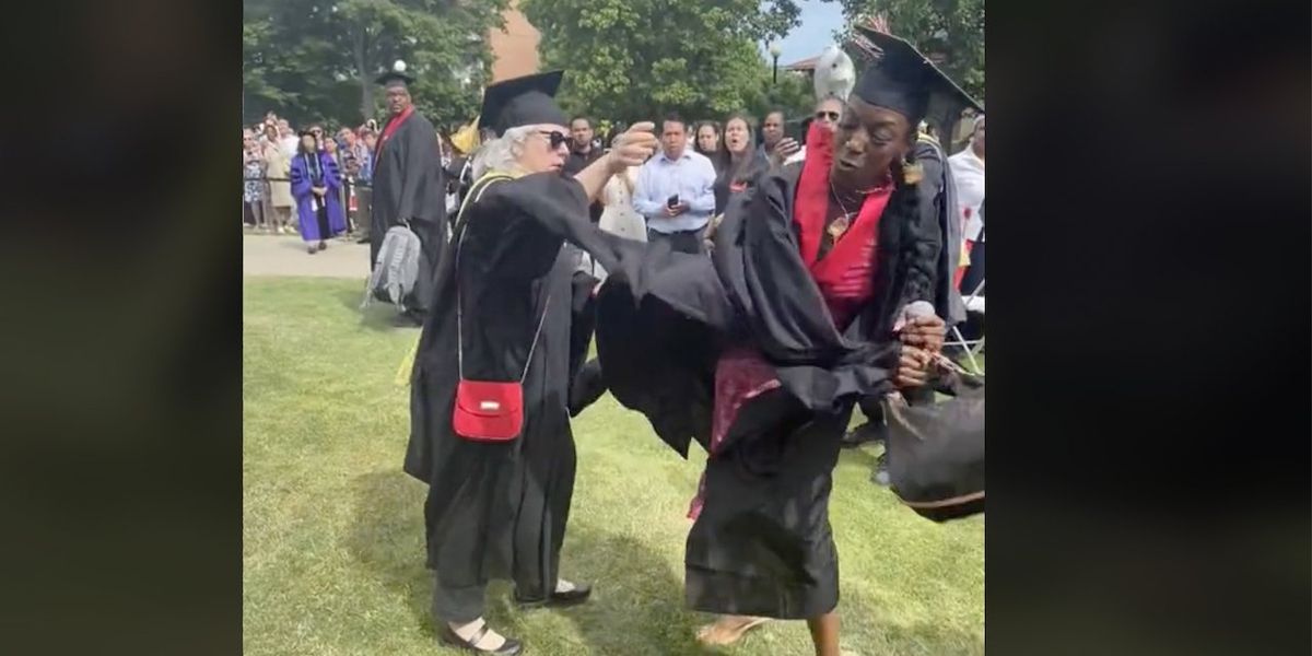 NextImg:Graduate wrestles mic from apparent school official, declares to stunned crowd, 'You didn't let me get my moment ... today it's gonna be all about me!'