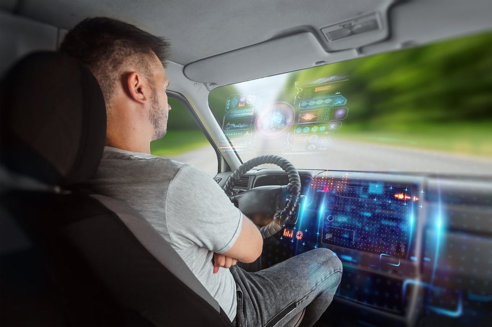 a man driving an autonomous vehicle