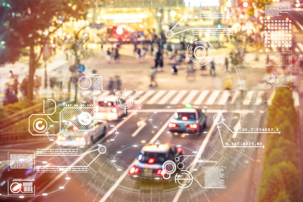 a photo of a road with data showing from the cars.