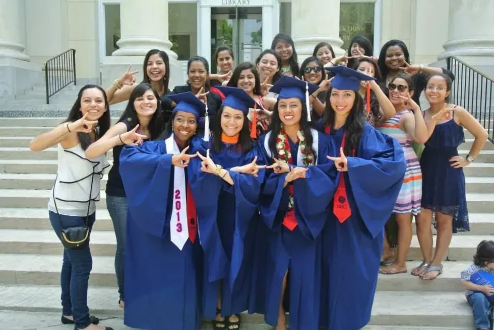 Girls from the Southern Methodist University, Pi Chapter posing for a graduation photo. Image via Facebook.