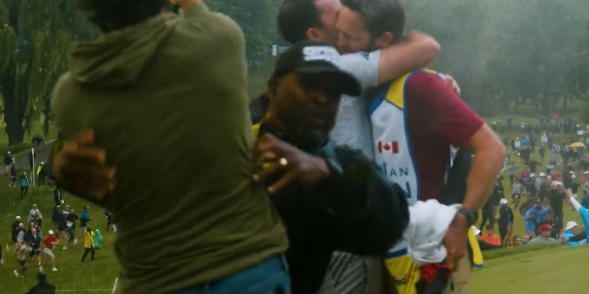 NextImg:Professional PGA golfer tackled by security while trying to celebrate Nick Taylor's Canadian Open-winning, 72-foot putt