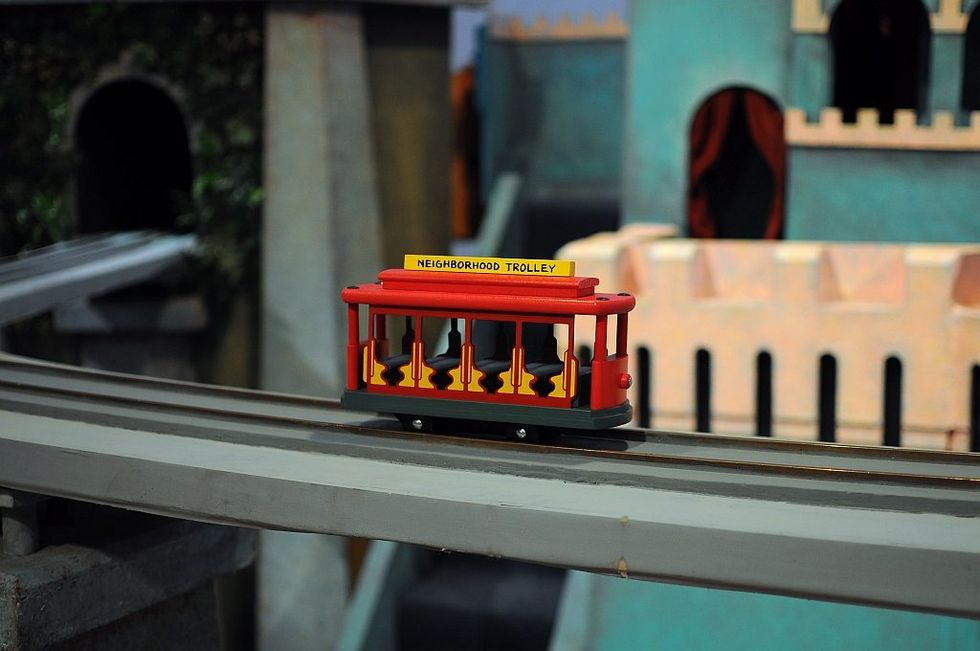 Red and yellow toy trolley on track