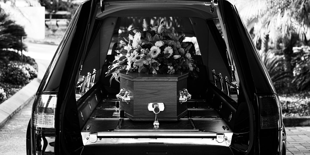 Coffin in a hearse. 