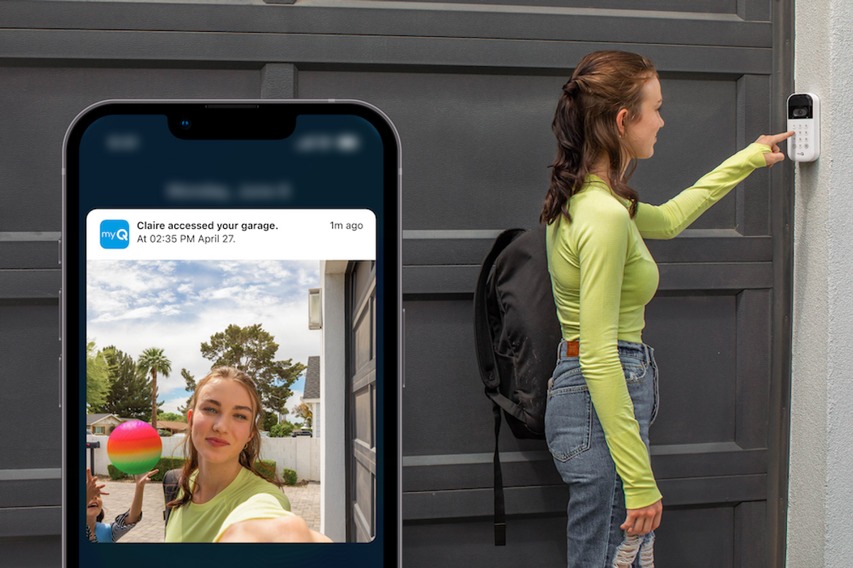 a photo of a woman opening garage door using myQ Smart Garage Video Keypad