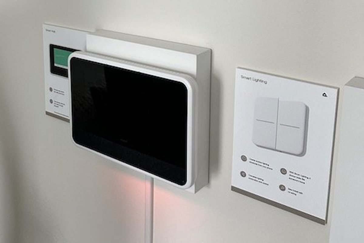 a photo of Vivint Smart Lighting Switch next to Vivint Smart Hub