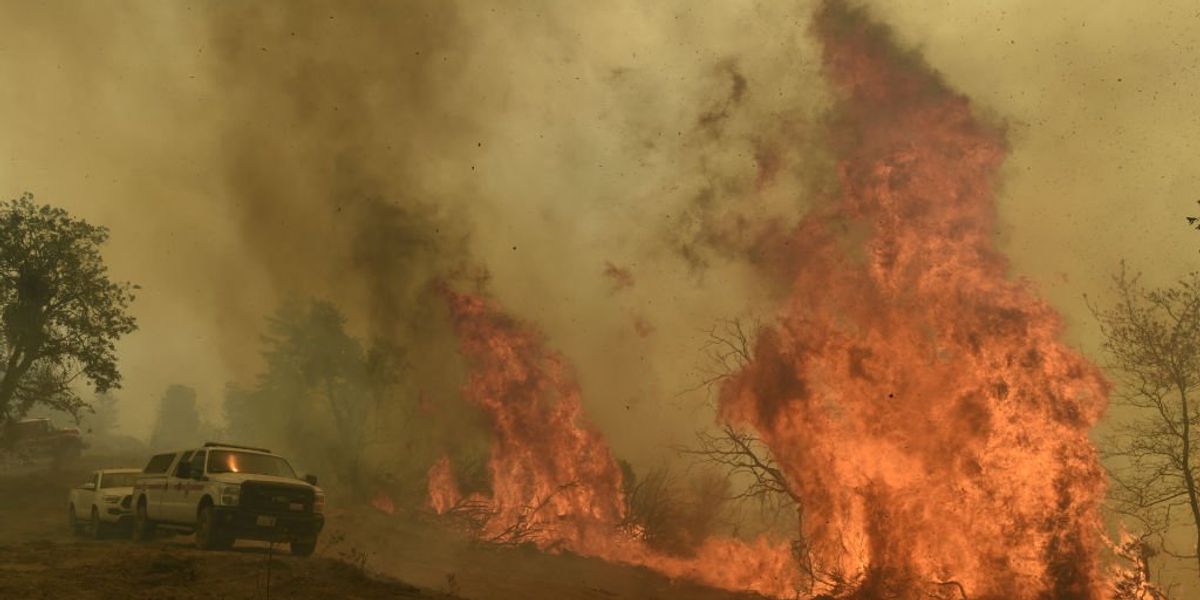 NextImg:California man arrested on suspicion of starting fire that destroyed nearly 200 buildings, forced 6,000 people to flee, burned 19,000 acres