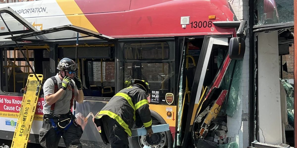 NextImg:Multiple people injured when Baltimore bus collides with 2 vehicles, occupied building