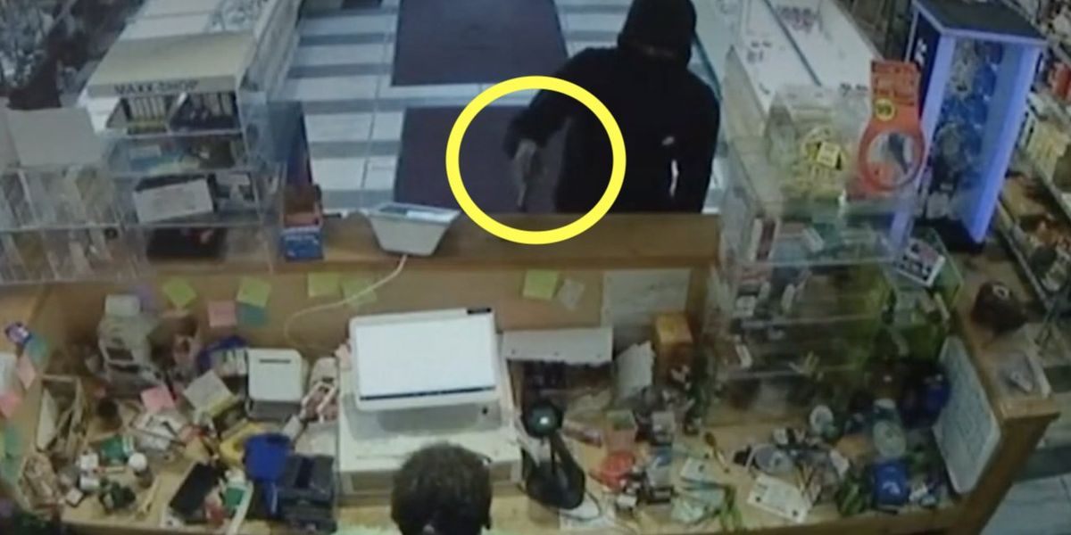 NextImg:Video: Masked thug points gun at female clerk in smoke shop, demands cash and vapes. But she's not about to let him waltz away without a fight.