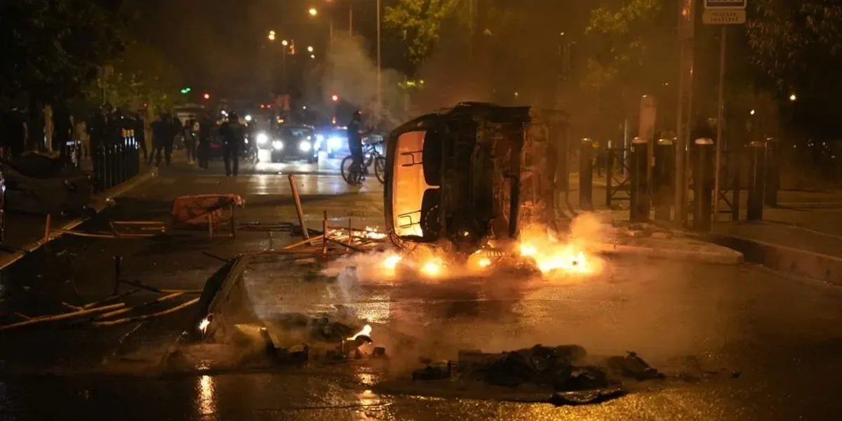 French race rioters ram burning car into conservative mayor's house where his wife and young daughters slept as part of 'cowardly assassination attempt'