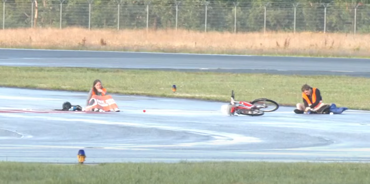 NextImg:Climate change extremists glue themselves to German airport runways, cause travel turmoil