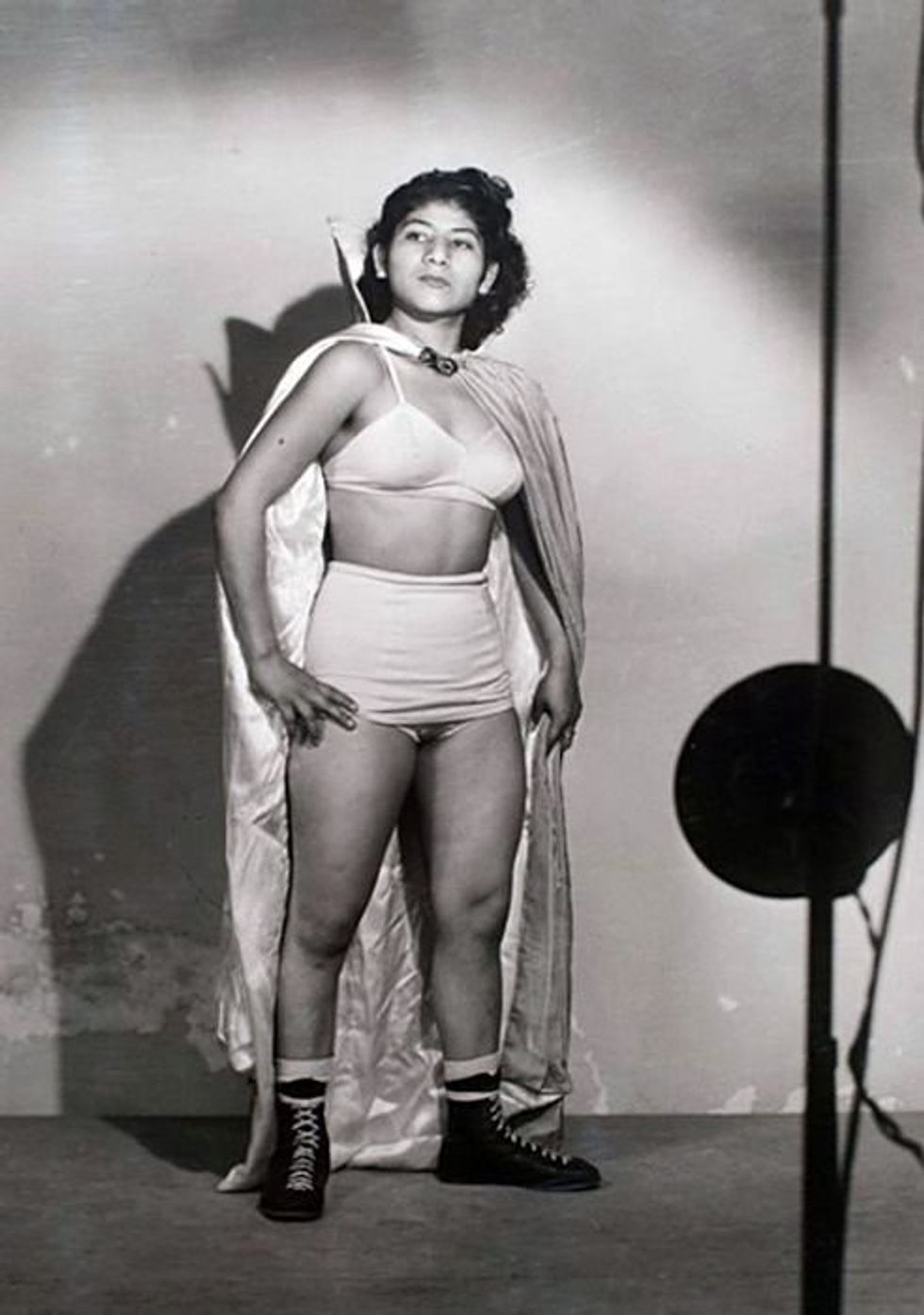 a black and white photo photo of Irma Gonzalez, La Novia del Santo, a female lucha libre wrestler or luchadora