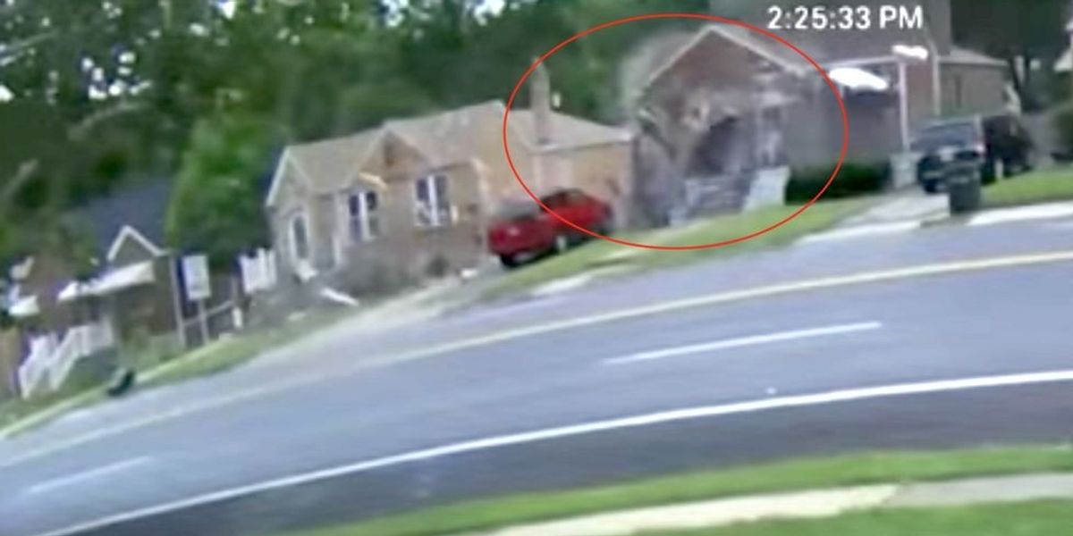 NextImg:Unbelievable video captures the moment a car flies through the air and crashes into the side of a home, missing a child 'by inches'
