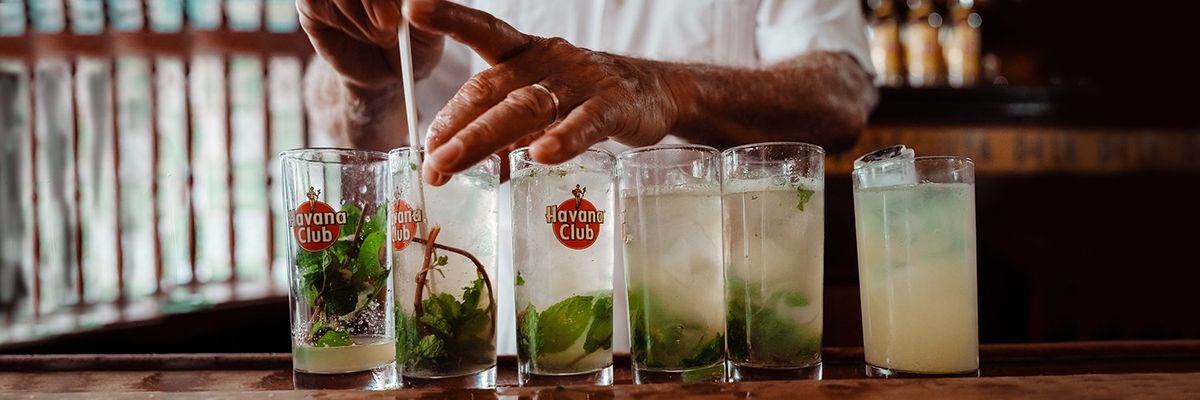 A man preparing cuban mojito cocktails