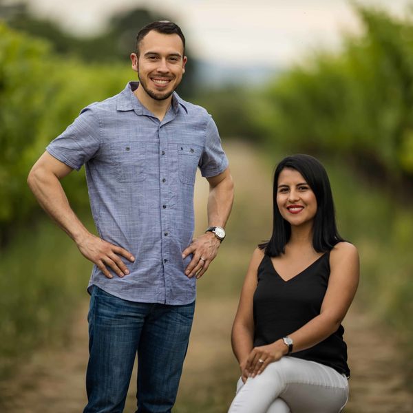 A photograph of Pedro and Jenny Rodriguez, owners of Fathia Wines