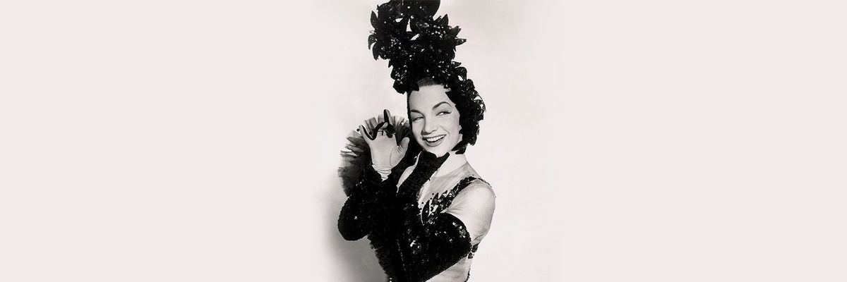 a black and white photograph of Carmen Miranda, Hollywood's Brazilian Bombshell or "the girl in the tutti frutti hat"