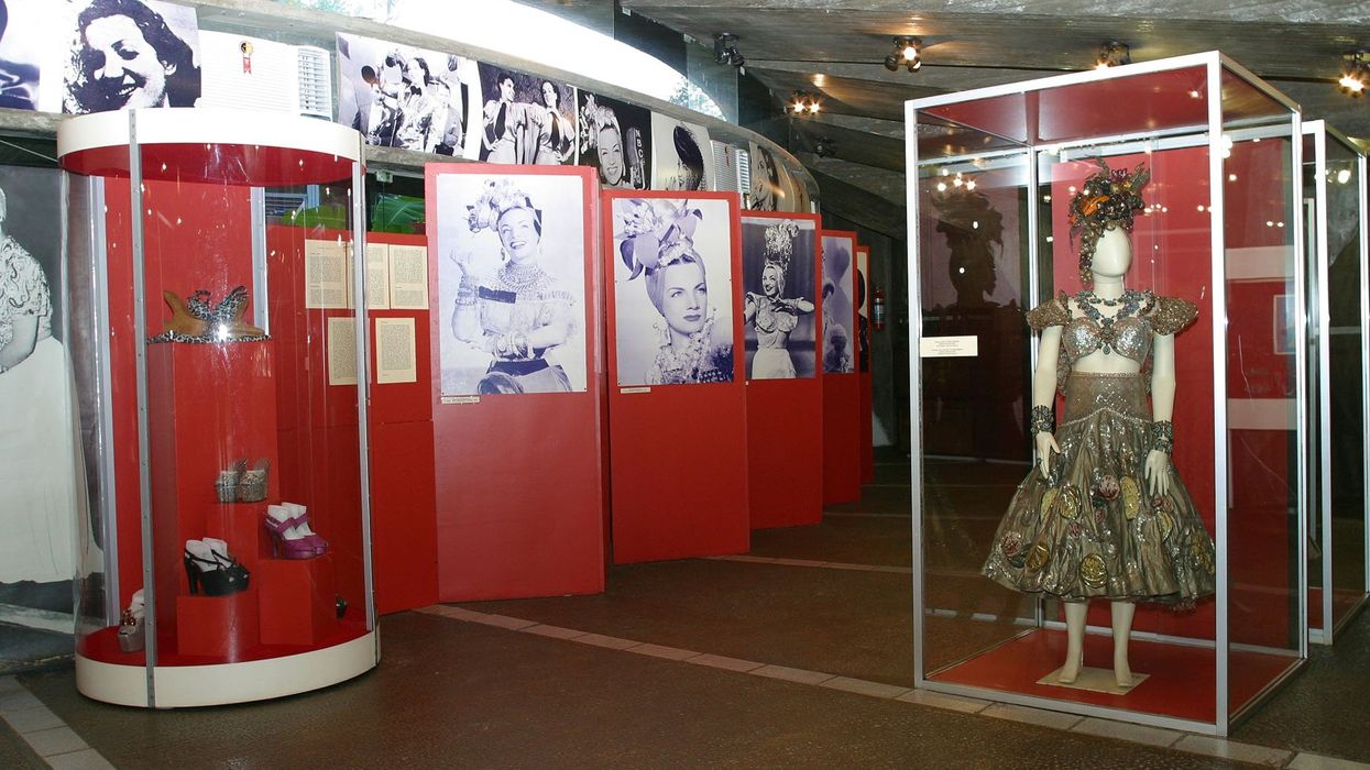 A photo inside the Museu Carmen Miranda showing photographs and clothing items of Carmen Miranda 