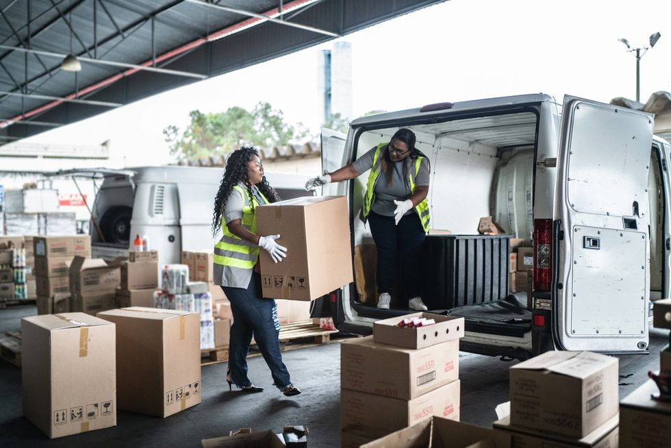 woman loading up a delivery van
