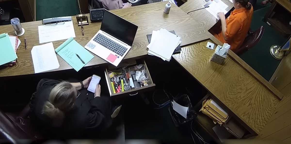 NextImg:Judge caught on camera scrolling on her phone for hours during trial of slain 2-year-old, even as victim's mother sobbed on stand