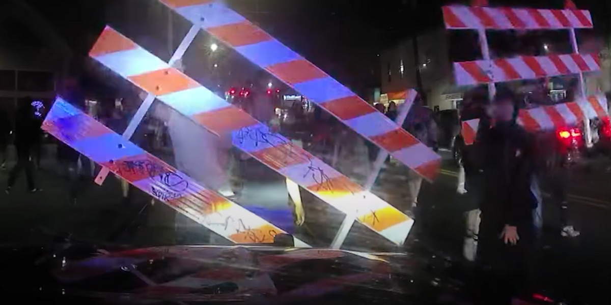 Video shows Seattle police retreat from unruly mob that stopped cops from breaking up illegal street-racing gathering where 4 people were shot