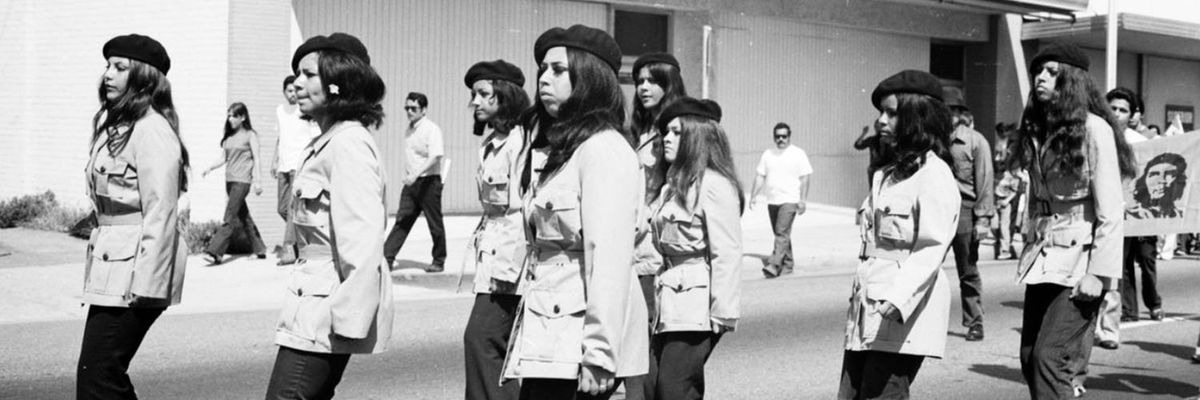 a black and white photo of las adelitas de aztlan in their distinctive berets