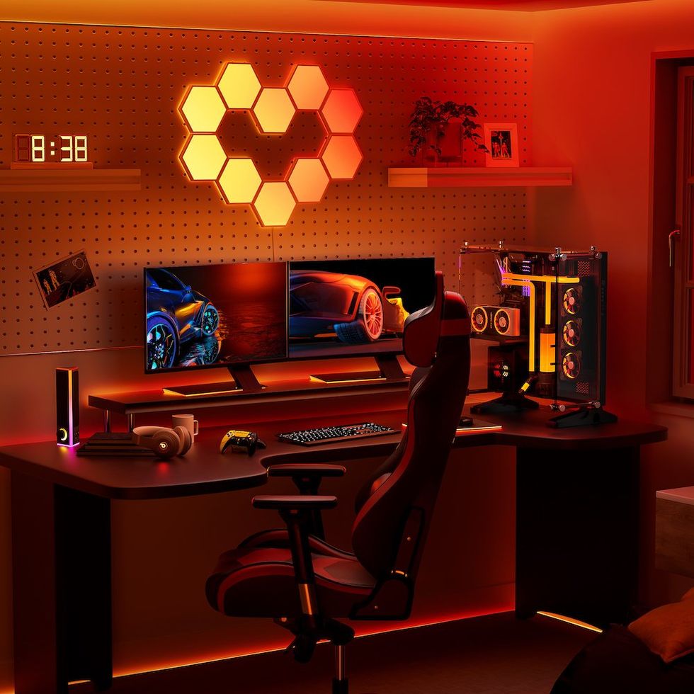 a photo of Cync Dynamic Effects Smart Hexagon Panels on the wall showing orange colos