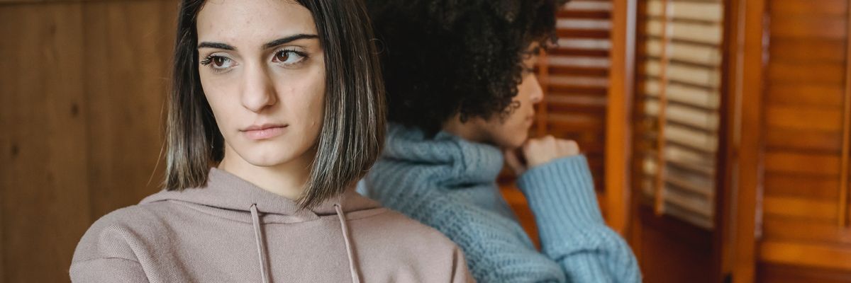 image of two women ignoring each other