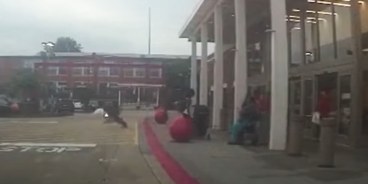 Police bodycam video shows Atlanta cop making football tackle on shoplifter accused of stealing big-screen TVs from Target: 'I don’t want to go to f***ing jail!'