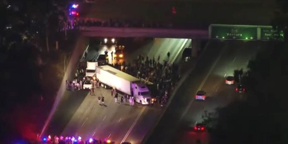 NextImg:Protesters block highway with semi-truck, causing massive traffic backup to demand intervention in Armenian crisis