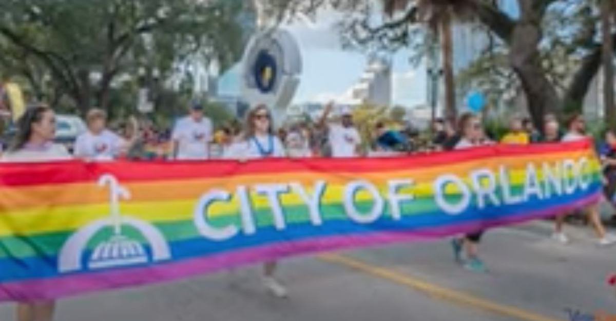 YouTube screenshot of demonstrators with Orlando Pride banner
