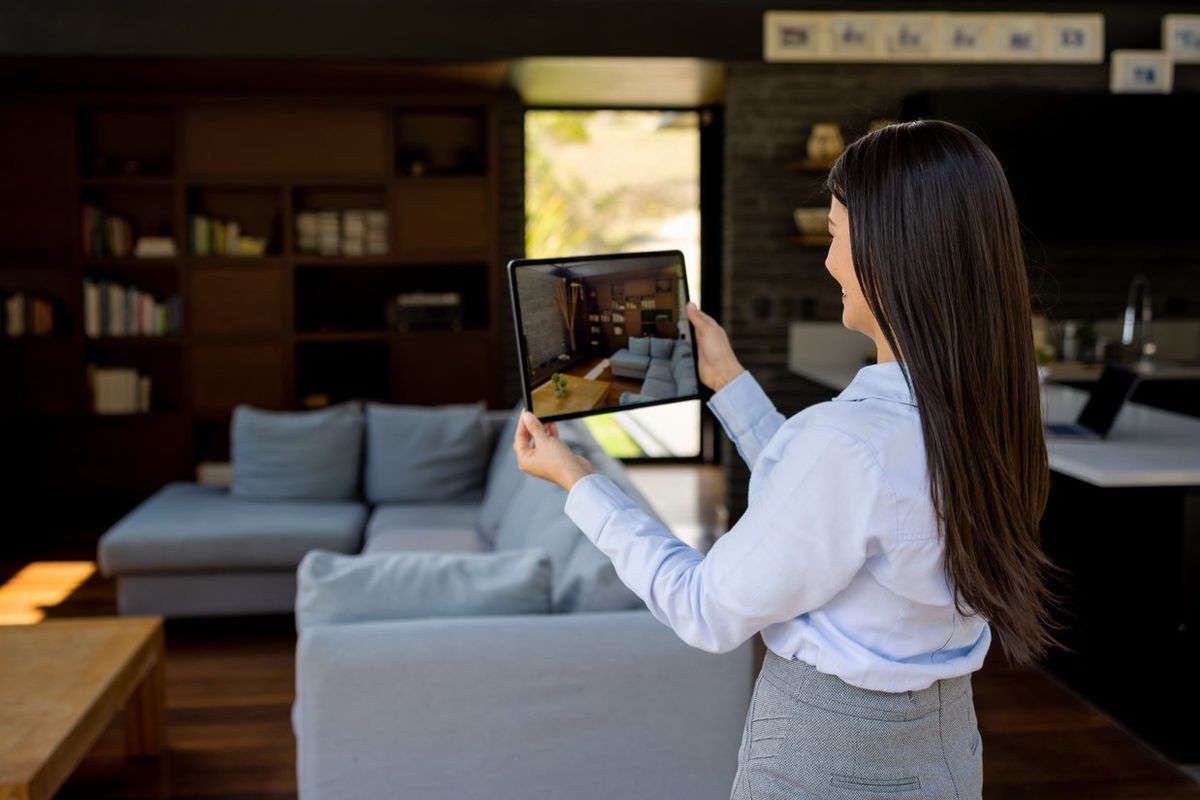 a photo of Real estate agent making a virtual showing of a house for sale