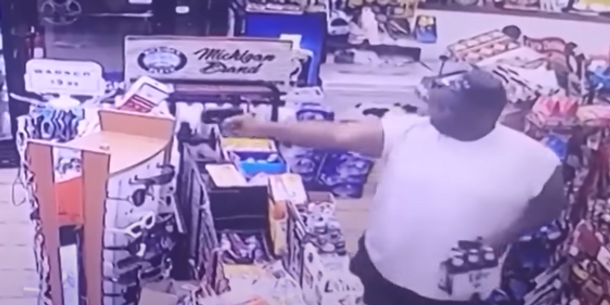 NextImg:Video shows the moment hero customer guns down robber while holding a six-pack of Miller Lite beer