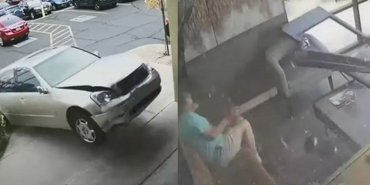 NextImg:Wild video shows man coming within feet of death as airborne car crashes into Arizona salon: 'I had an angel on my side'