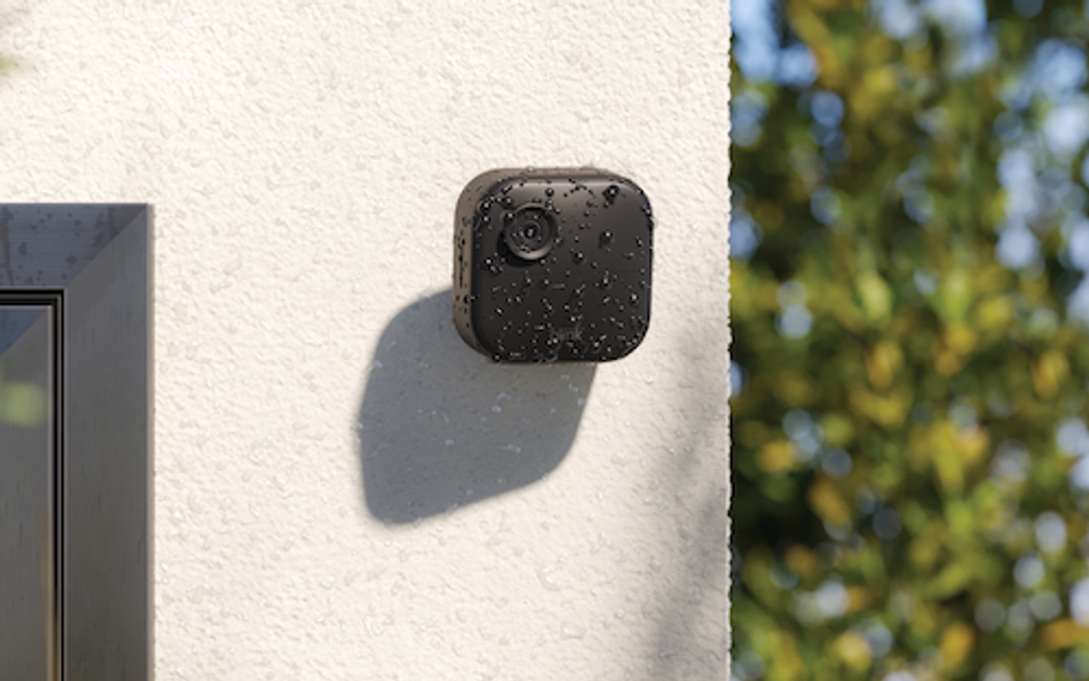 photo of Blink Outdoor 4 on the side of the house with water drops on it.