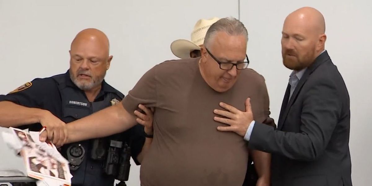 NextImg:Man removed from school board meeting while reading from sexually explicit book that had been available in school library