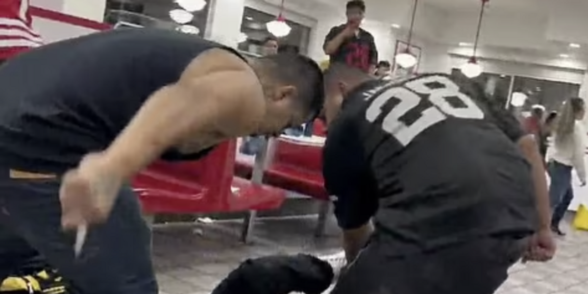 NextImg:Video shows the moment 49ers and Raiders fans engage in bloody brawl at California In-N-Out, 2 people stabbed