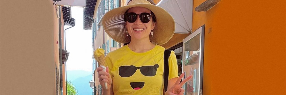 a photo of angela guzman with an emoji t-shirt and an ice cream
