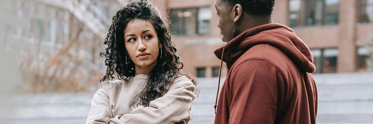 a woman giving the side eye to a man