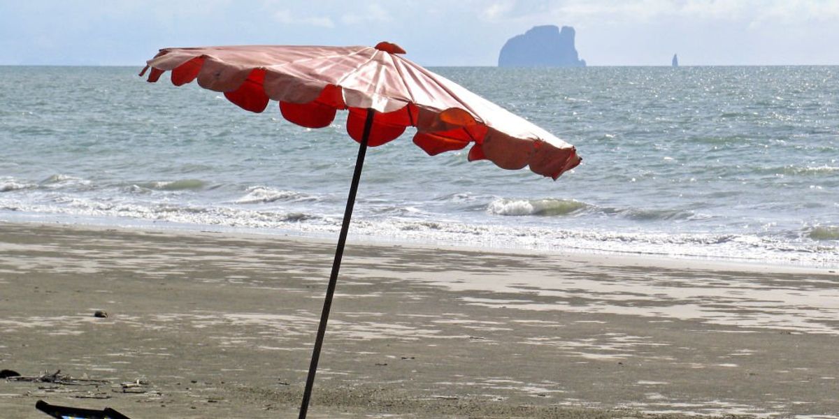 NextImg:Woman impaled in leg by beach umbrella