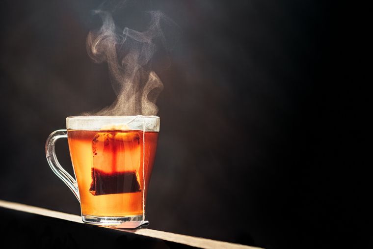 Glass Of Chai With An Old Fashioned Kettle Isolated Over White Background  High-Res Stock Photo - Getty Images