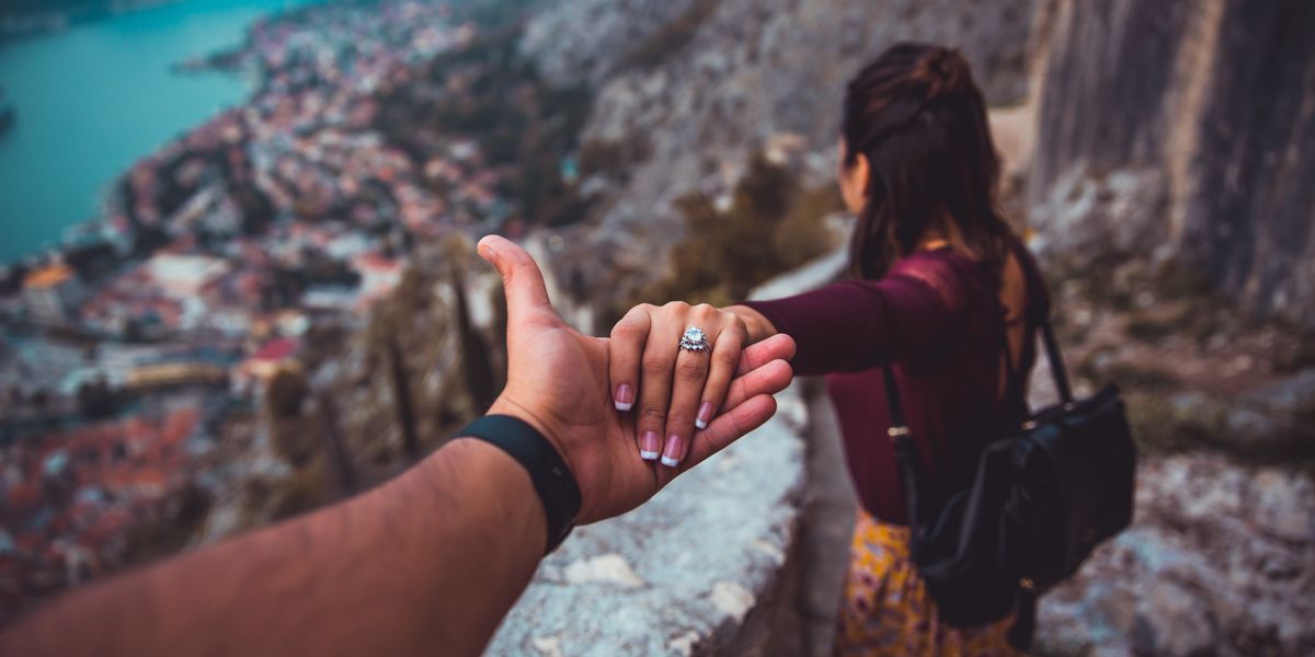 Two people getting go of each other's hands
