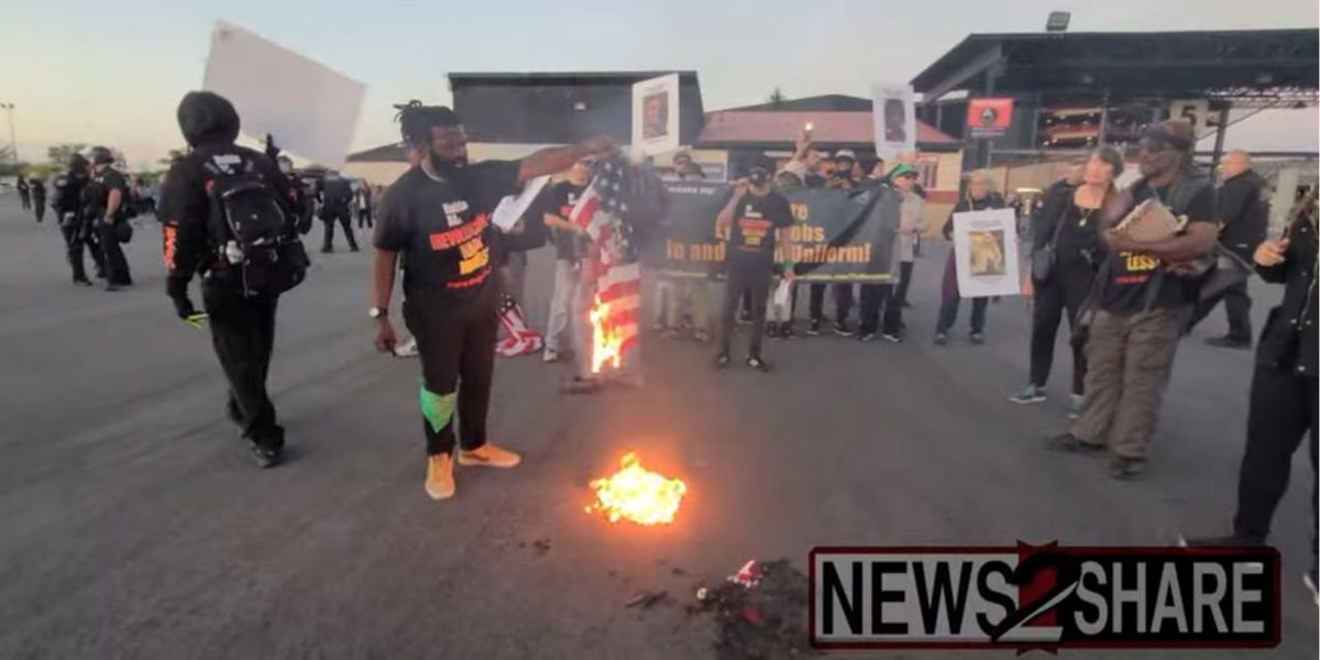 NextImg:Communists burn American flags outside Jason Aldean concert to protest singer's patriotic song