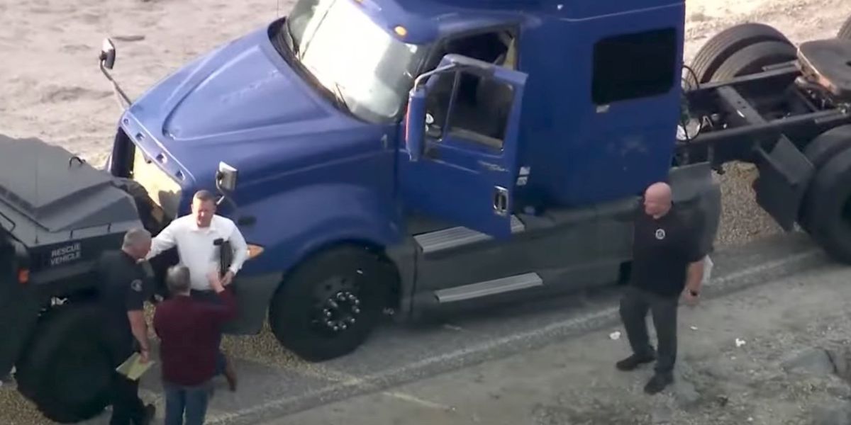 NextImg:Police on manhunt for suspect who allegedly rammed patrol car with stolen big rig and fled as police shot at him