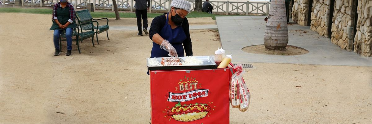 a woman in a hot dog stand