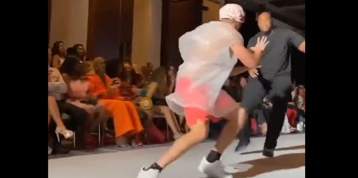NextImg:Watch: Prankster tackled after seamlessly taking to New York Fashion Week runway in a garbage bag