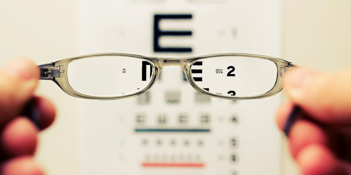 View of eye chart through a pair of spectacles