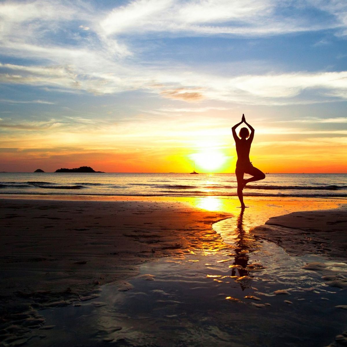 Why You Should Totally Do Beach Yoga