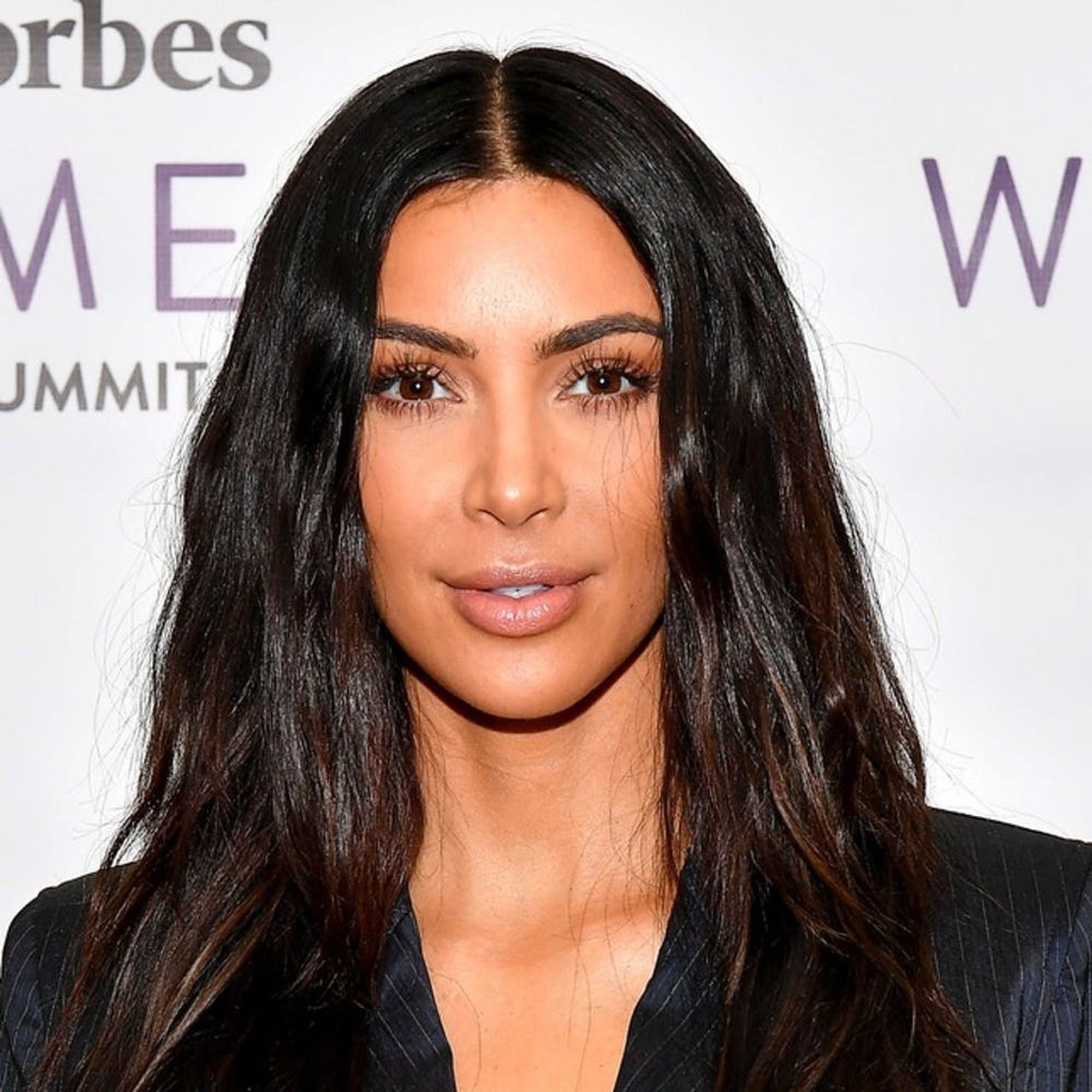 Kim Kardashian West Sprays Sunless Tanner Where?! Brit + Co